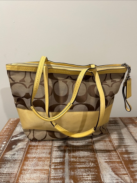 Coach Handbags - Coach Brown Signature Canvas Tote with Yellow Trim